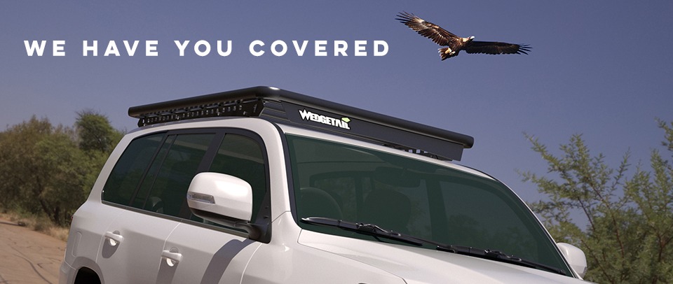 Wedgetail roof rack on a LandCruiser 200 Series with text above it reading "we have you covered".