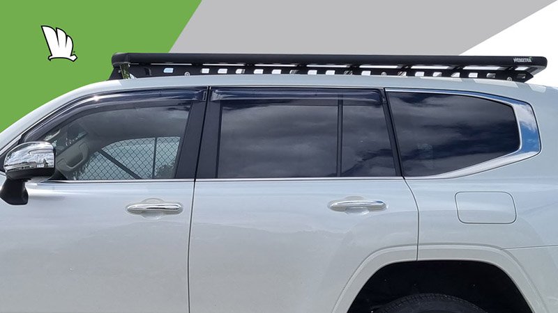 Side view of the Wedgetail roof rack installed on a Toyota LandCruiser 300 Series showing the one piece mounting rails and the eight cross bars installed to give the platform its super strength and the outer frame to which the cross bars are bolted.