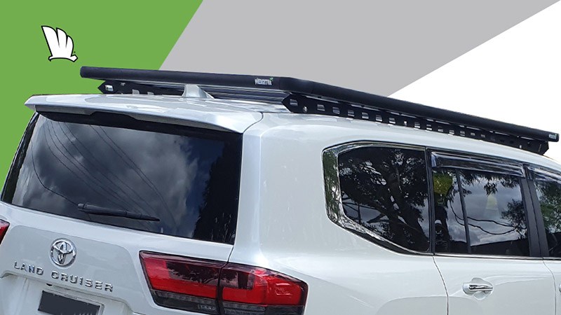Rear angled view of the Wedgetail roof rack installed on a Toyota LandCruiser 300 Series showing the one piece mounting rails which spread the load over the whole roof to give the platform its super strength and enables it to retain a full load rating on the toughest of Australian roads.