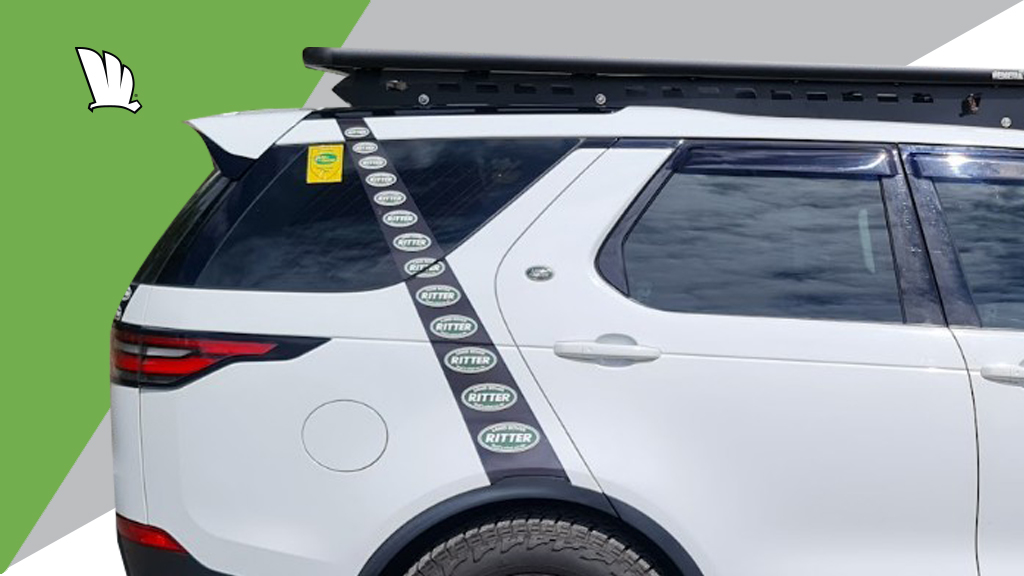 Front view of the Wedgetail platform roof rack. The one-piece mounting rails fit to the roof line so that the platform sits on a flat mounting rail. The wind deflector is mounted on the back of the front bar of the platform frame.