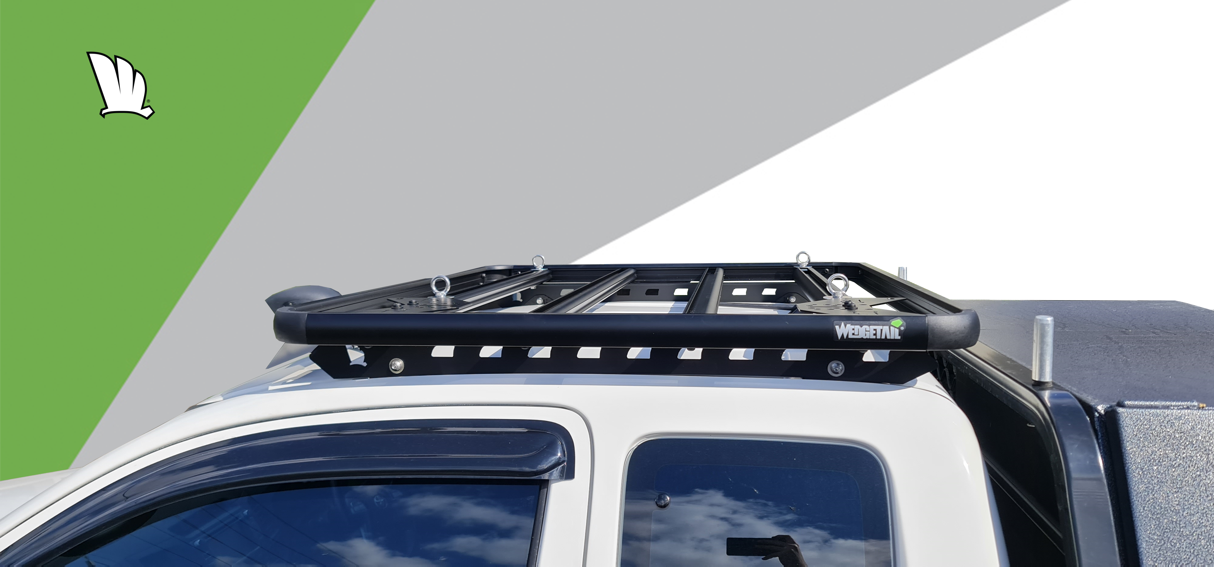 Modified 2015 HiLux with a Wedgetail roof rack installed on the dual cabin. Wedgetail rack has a lightbar fitted at front of platform frame. Hero image for page.