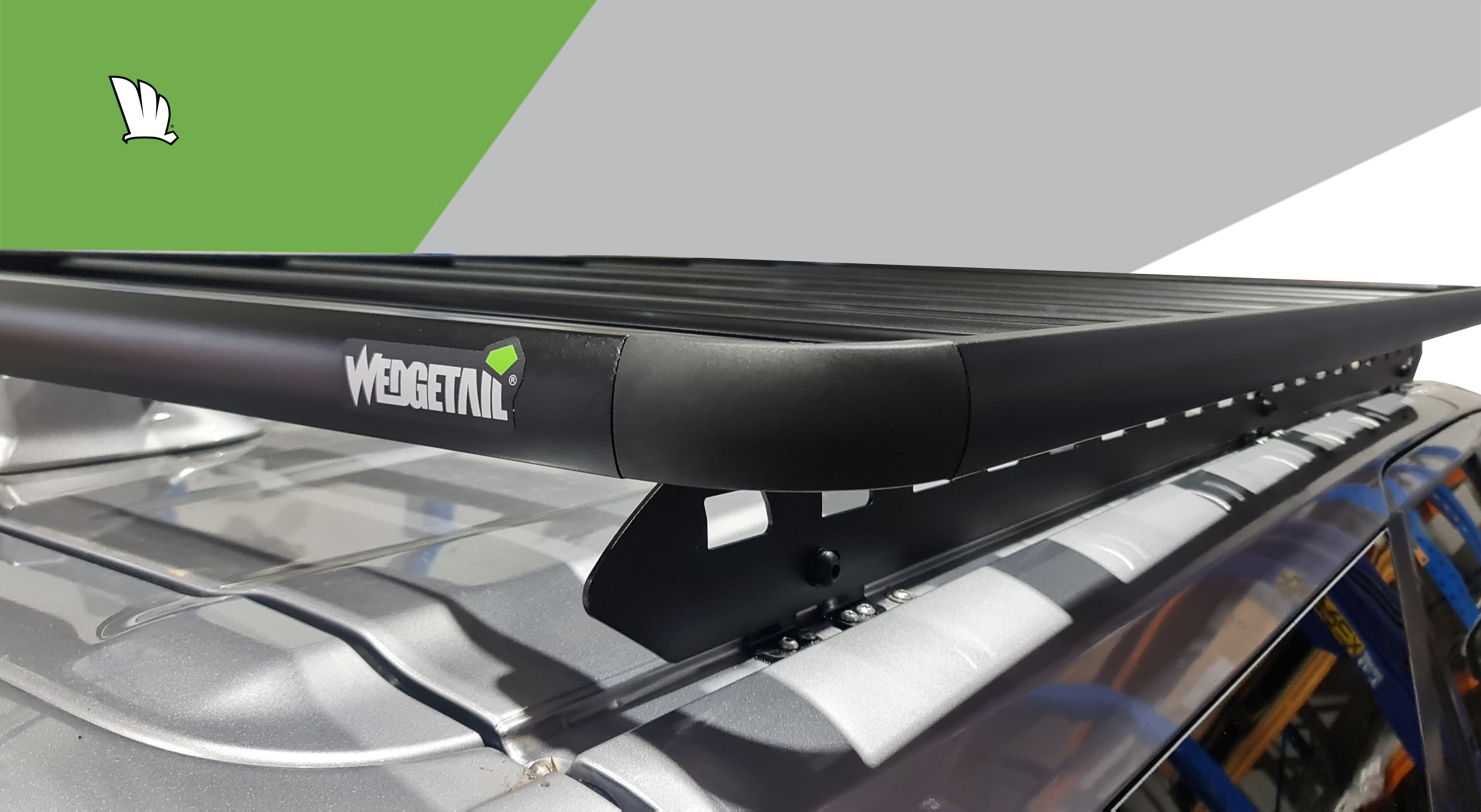Front view of the Wedgetail rack on the Fortuner showing the owner installed light bar and our standard wind deflector, the mounting points for the one piece mounting rails and the platform on top with seven cross bars to give superior strength.