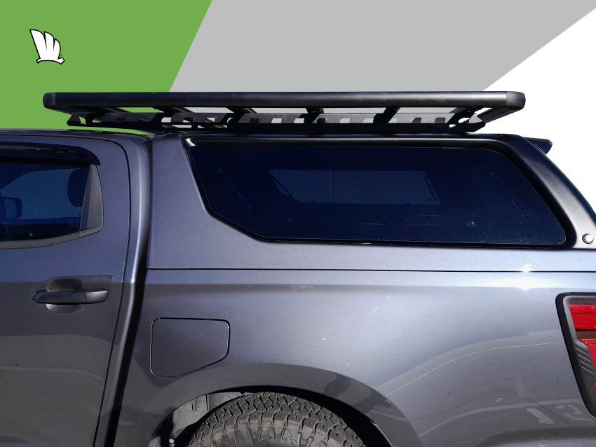 Side view of the Wedgetail rack on the cabin roof of the HiLux showing the one piece mounting rails with two connection points and the platform roof rack attached to the mounting rails at each of the five cross bars.